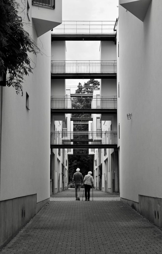 older couple strolling through modern architecture in hamburg
