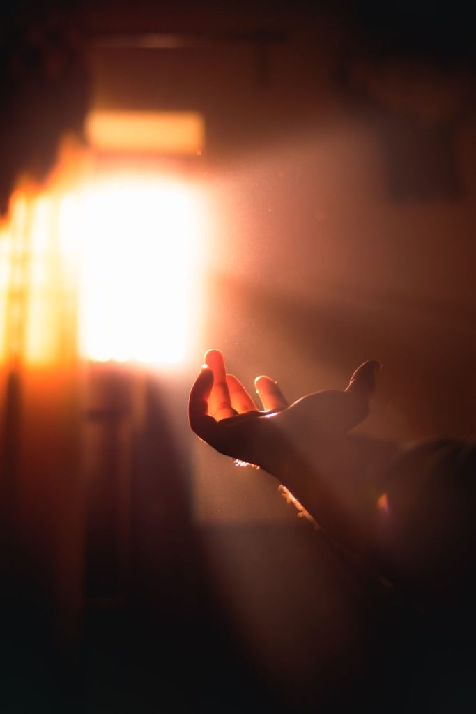 human hand in light at the concert